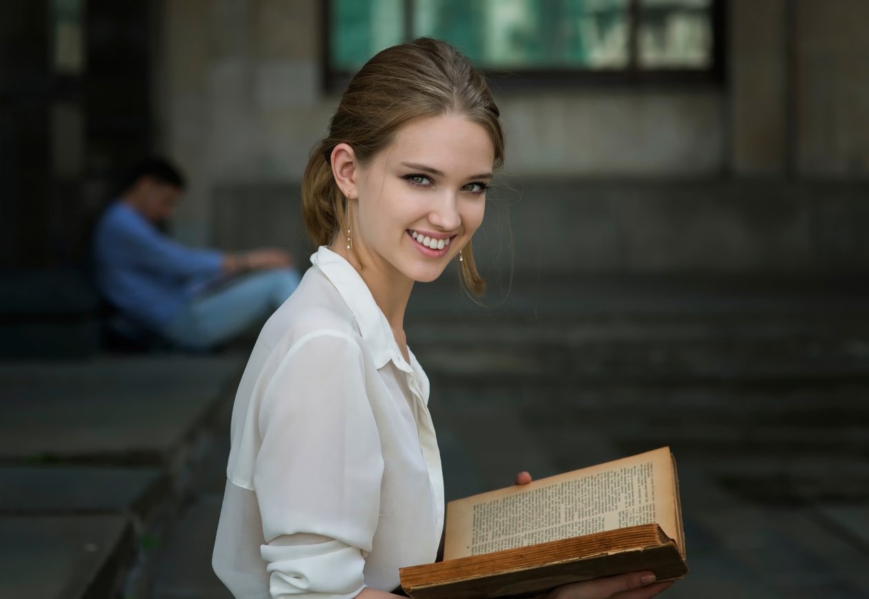 Cute Girl Smiling Book In Hand