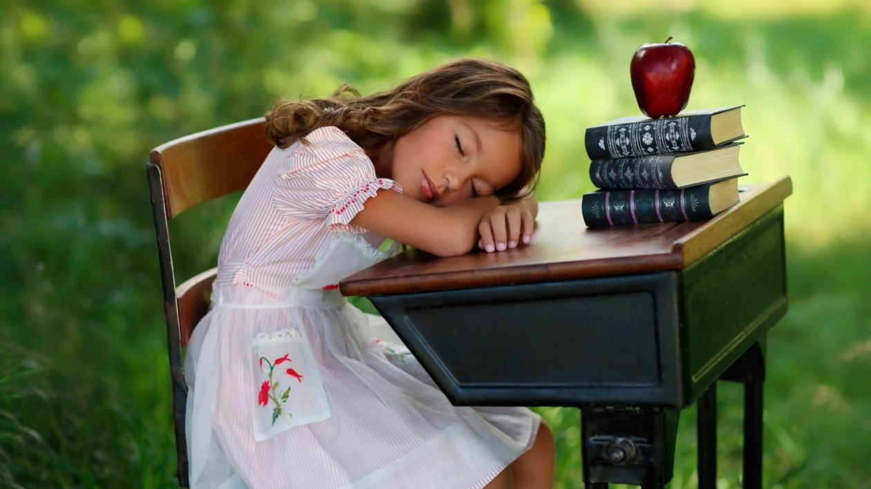 Child Sleeping On Table