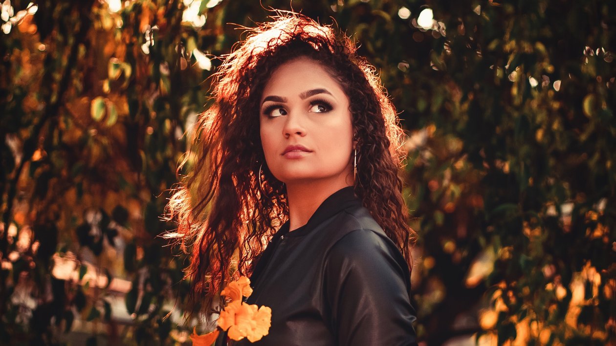 Women Walking With Flowers In Hand