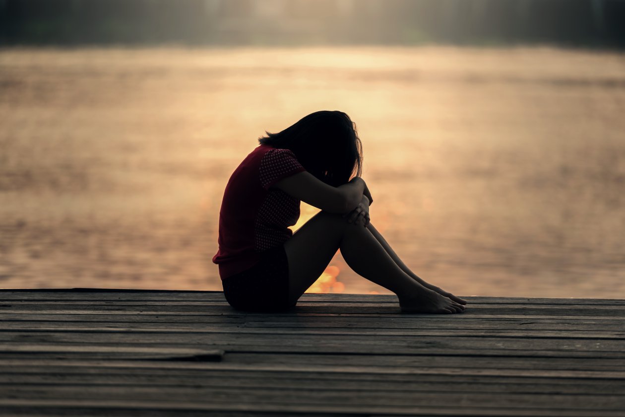 Sad Girl Sitting On Dock Silhouette