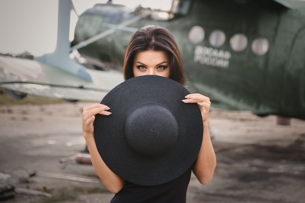 Girl Covering Her Face With Hat
