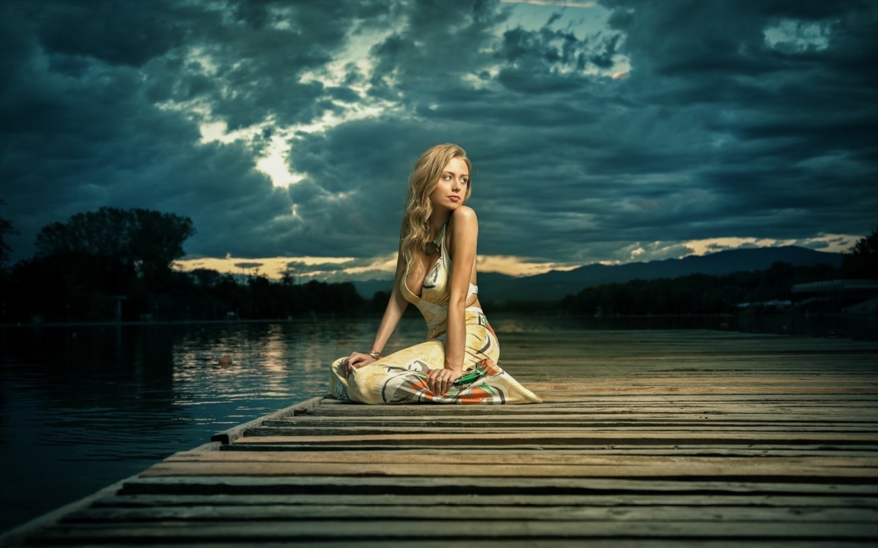 Girl Alone Sitting Near Lake