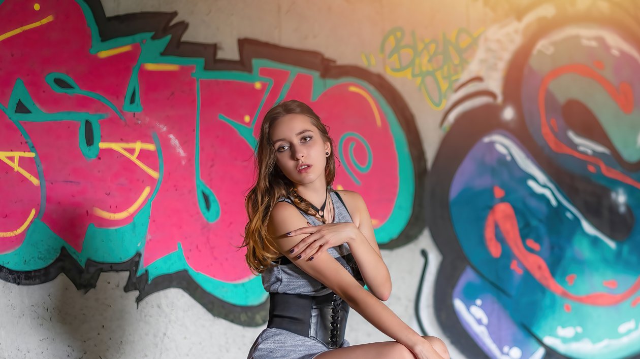 Girl Sitting Graffiti Wall 4k