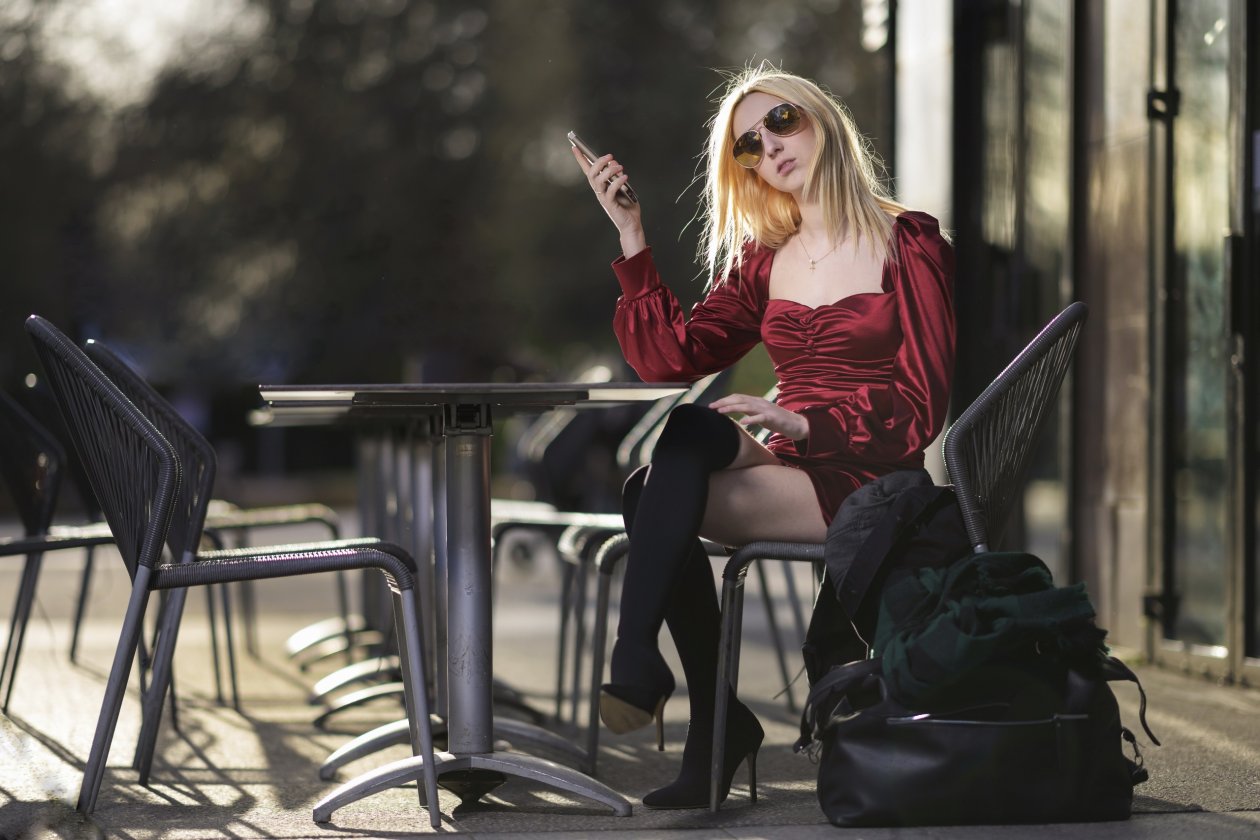 Blonde Girl With Shades Using Phone