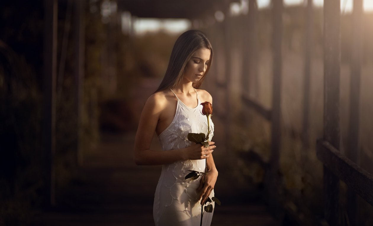 Girl With Rose In Hand