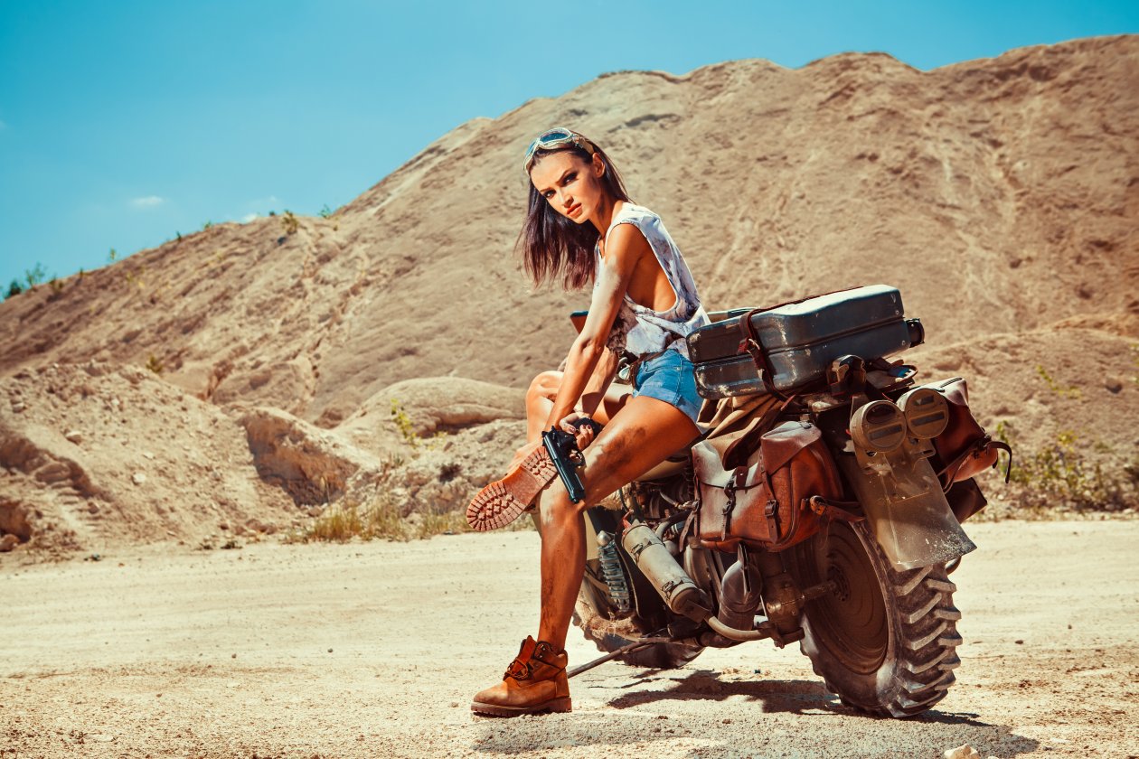 Woman With Gun And Motobike On The Desert 5k
