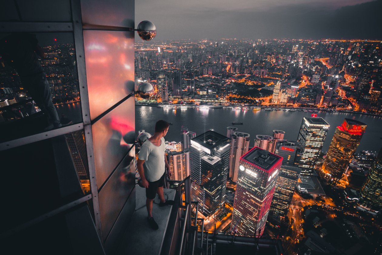 Boy Standing On The Rooftop Of Building Looking Down 5k