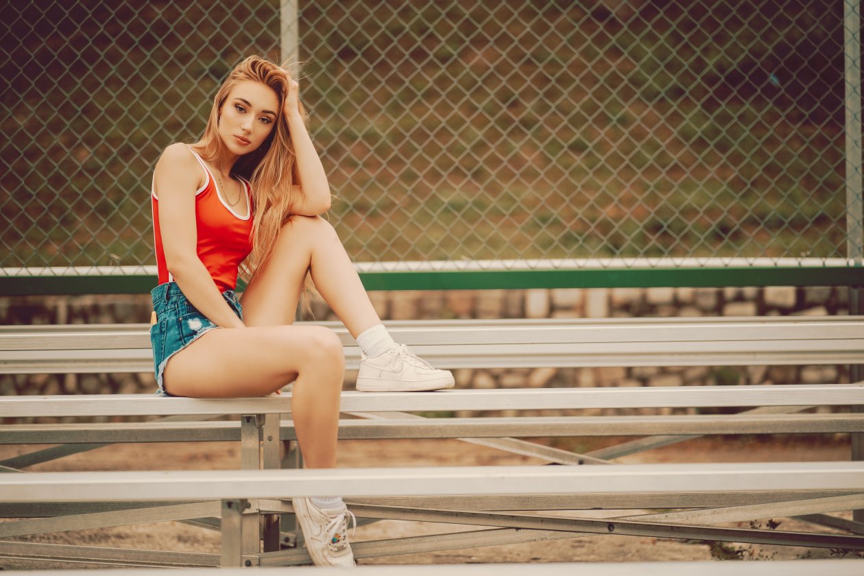 Girl Sneakers Hand On Head 4k