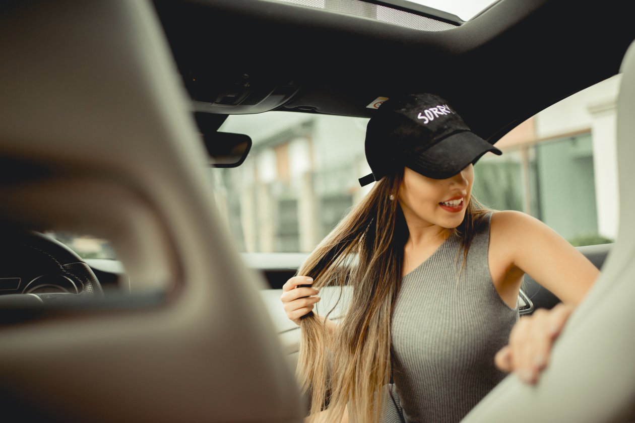 Girl With Basketball Cap In Car