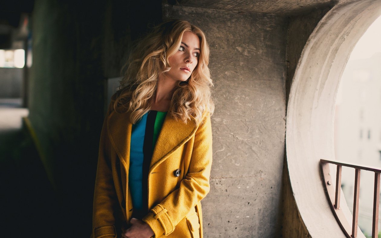 Girl Yellow Coat Looking Away