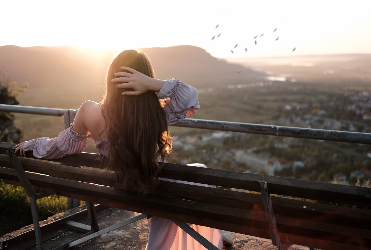 Girl Sitting Bench Back Hands In Hair Nature Outdoors