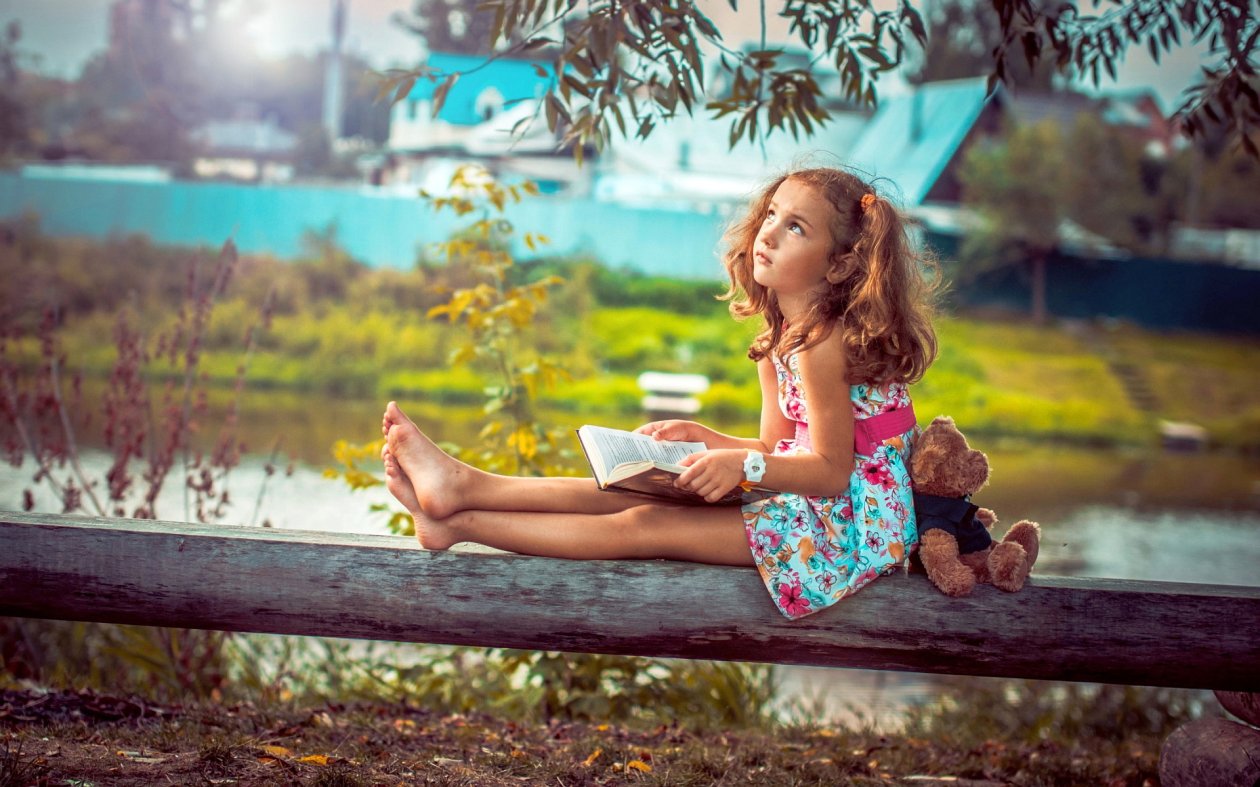Little Girl Reading A Book
