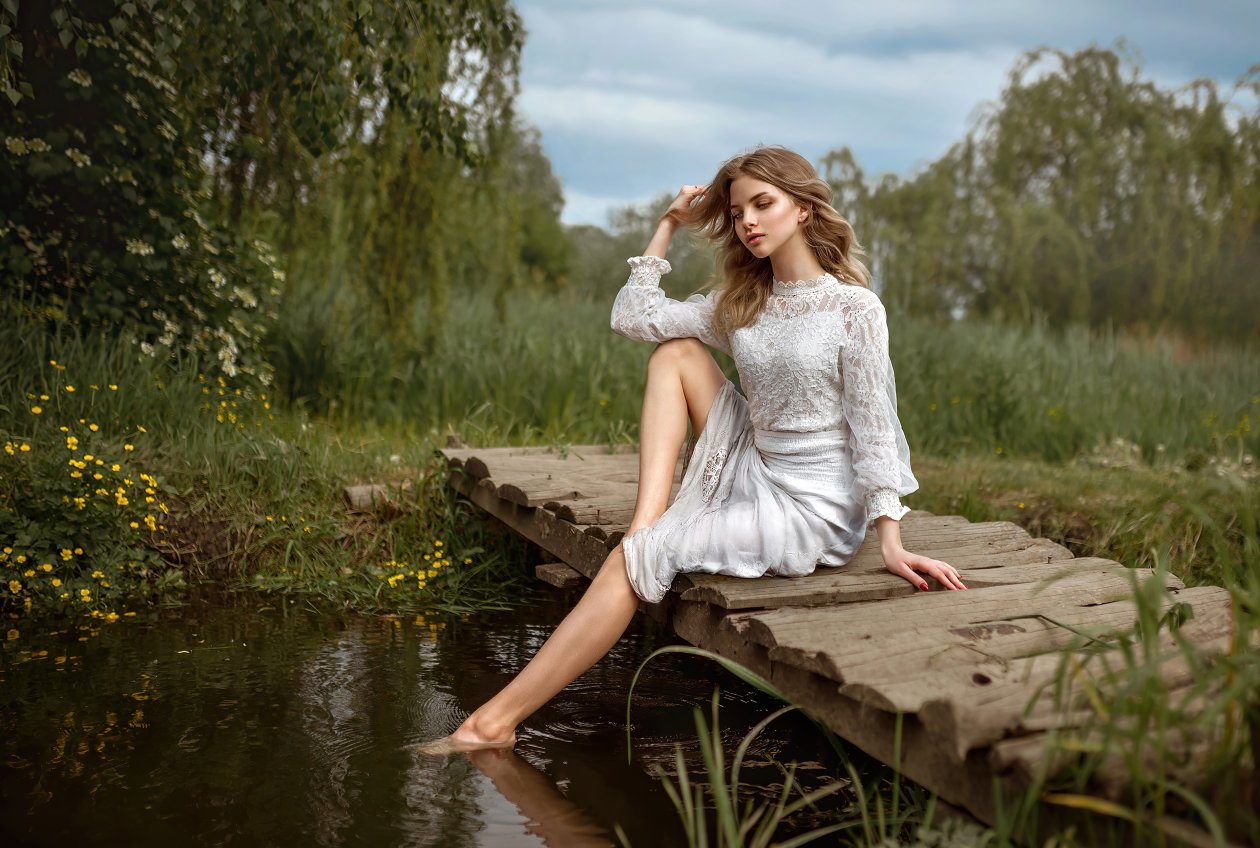 Blonde Girl White Dress Sitting At Pond