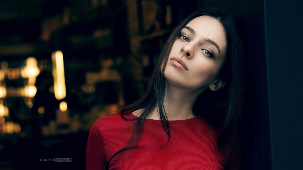 Girl In Red Looking At Viewer