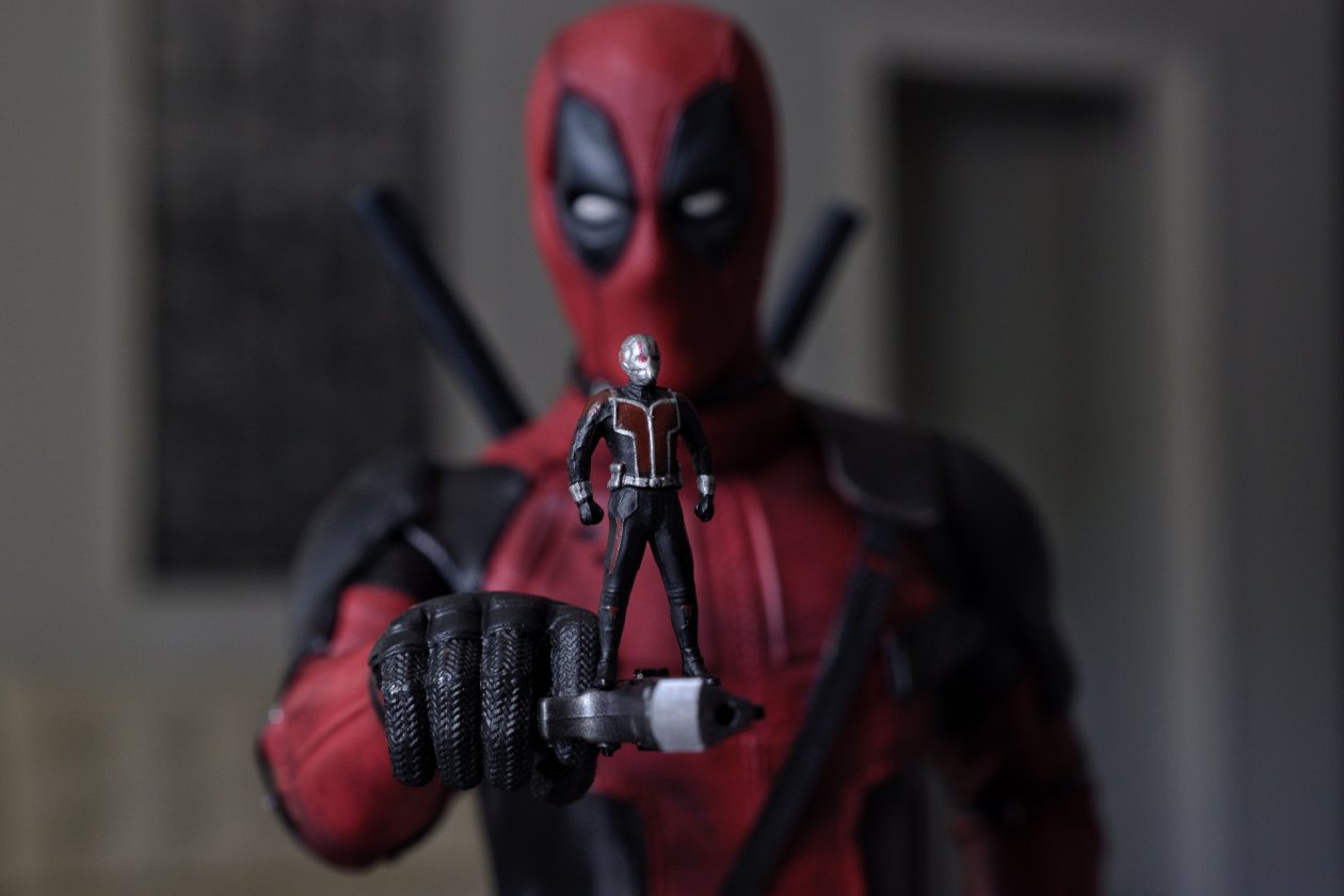 Ant Man Standing On Deadpool Gun