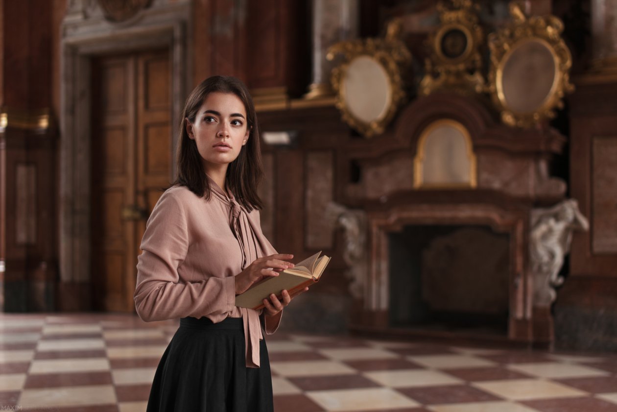 Lidia Savoderova With Book Looking Away