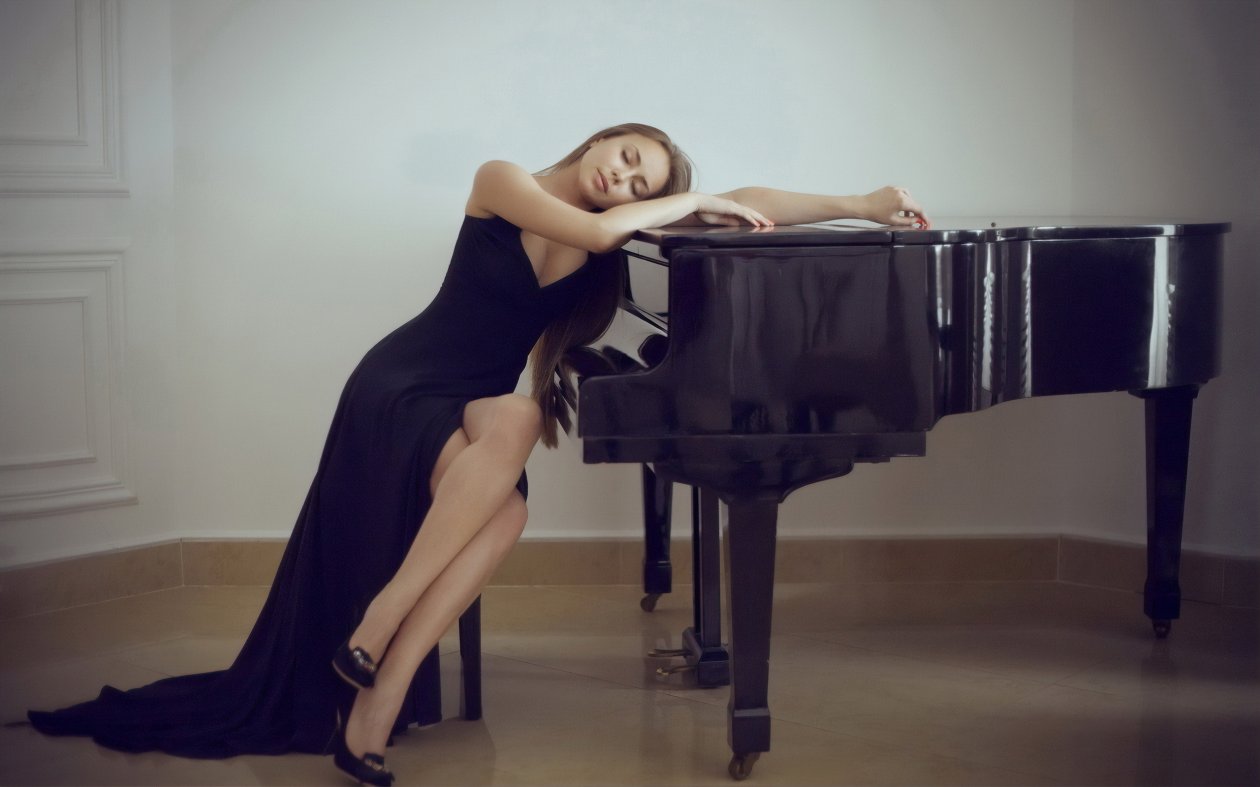 Girl In Black Dress Leaning Over Piano