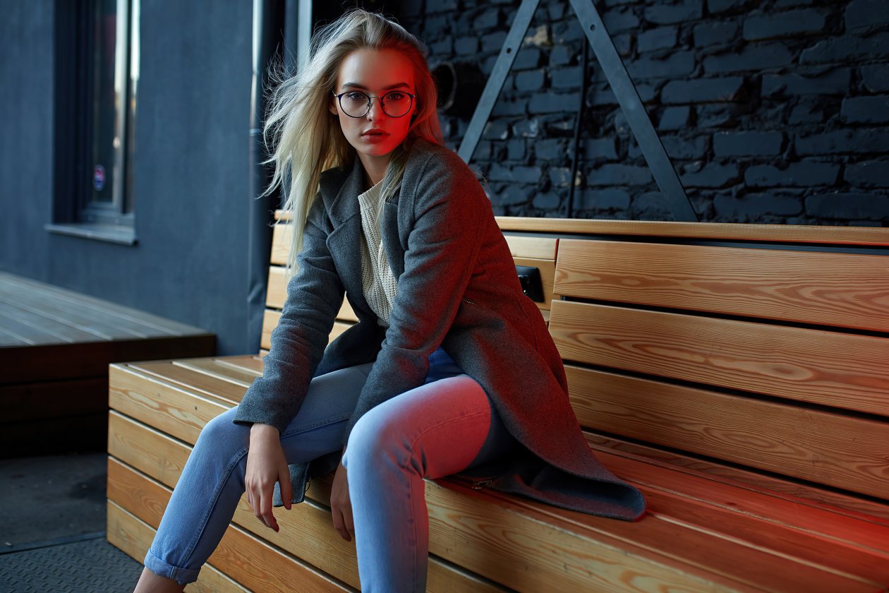 Blonde Girl With Glasses Sitting On Table 4k