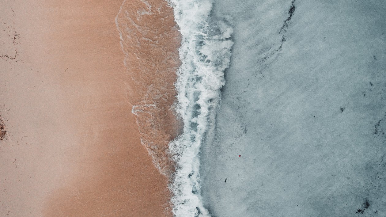Aerial Beach Waves At Sea Shore