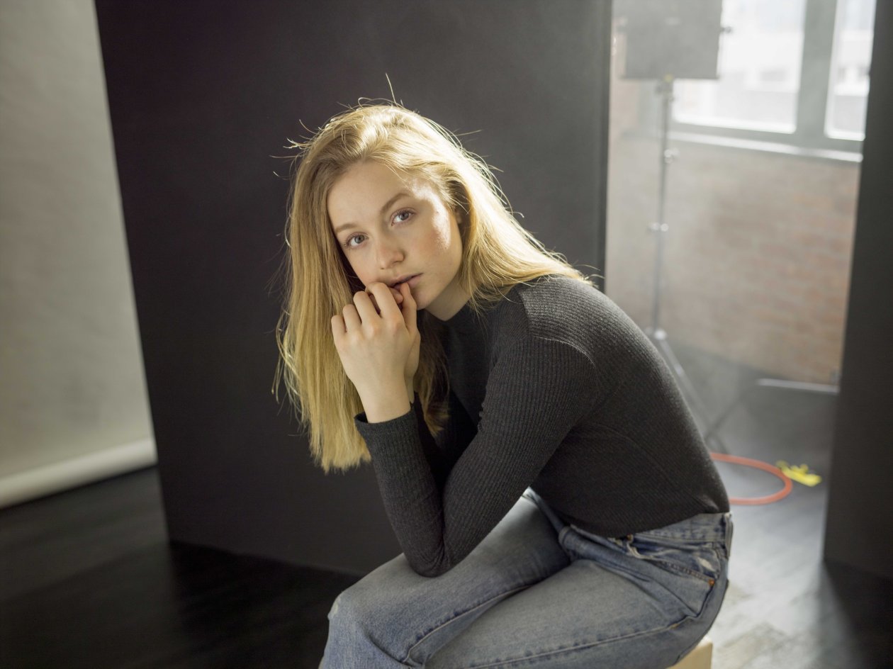 Beautiful Girl Sitting Looking At Viewer