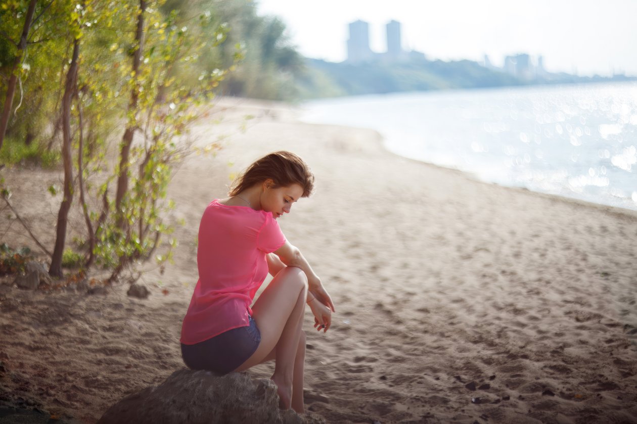 Girl Beach Sitting On Rock