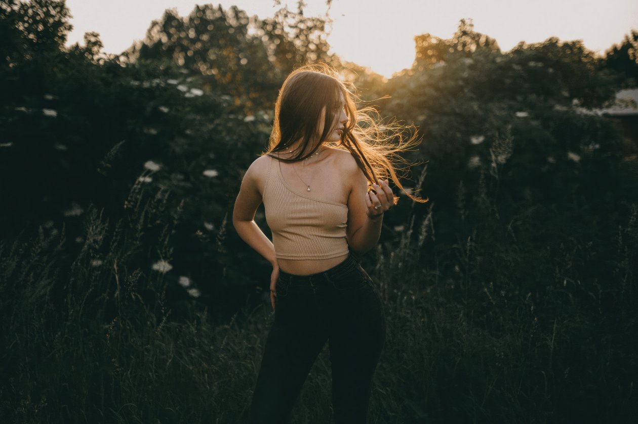 Girl Illuminated By The Gentle Rays Of Sunlight