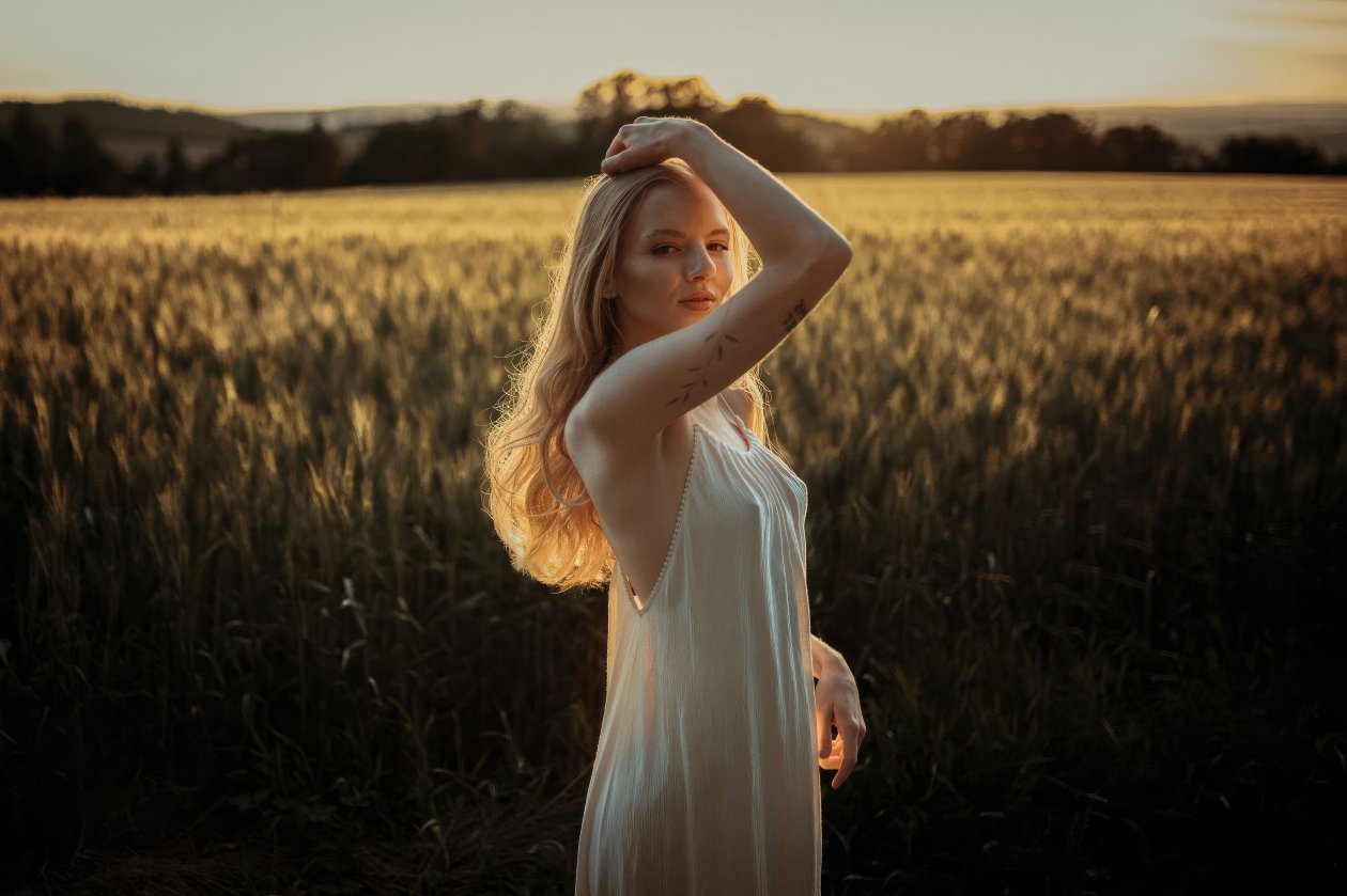 Girl In White Dress Basks In The Warm Of Rays