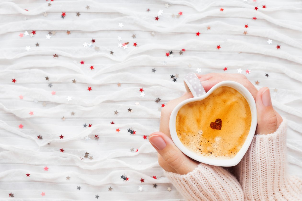 Heart Shaped Coffee Cup In Hands