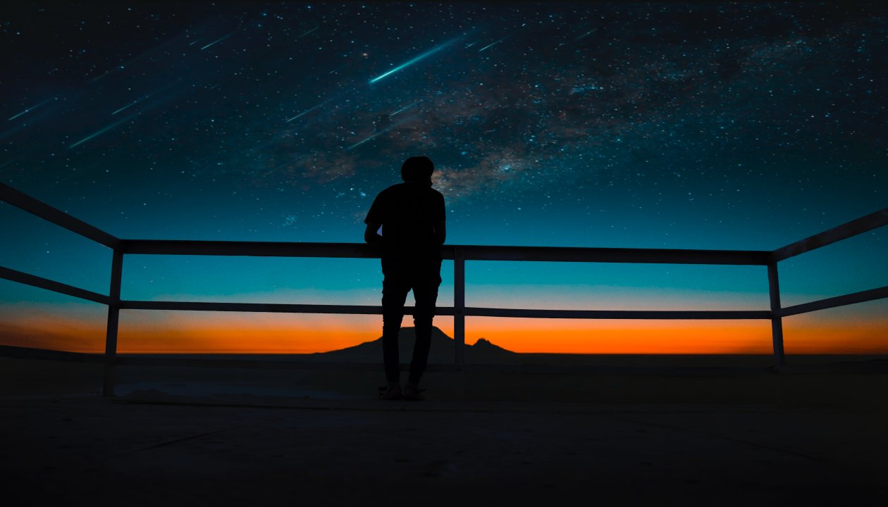 Person Silhouette Meteors Night Sky 8k