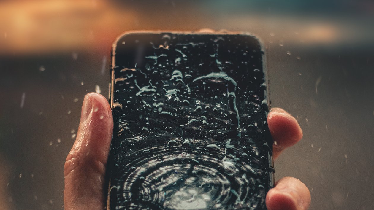 Raindrops On Phone Display In Hand Outdoors 4k