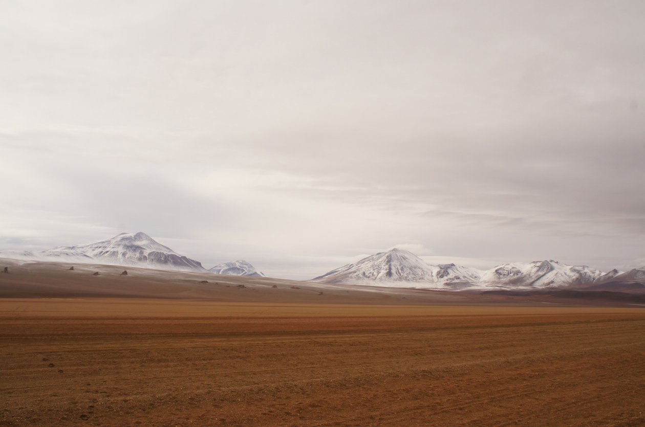 Snow On A Mountain Behind The Desert