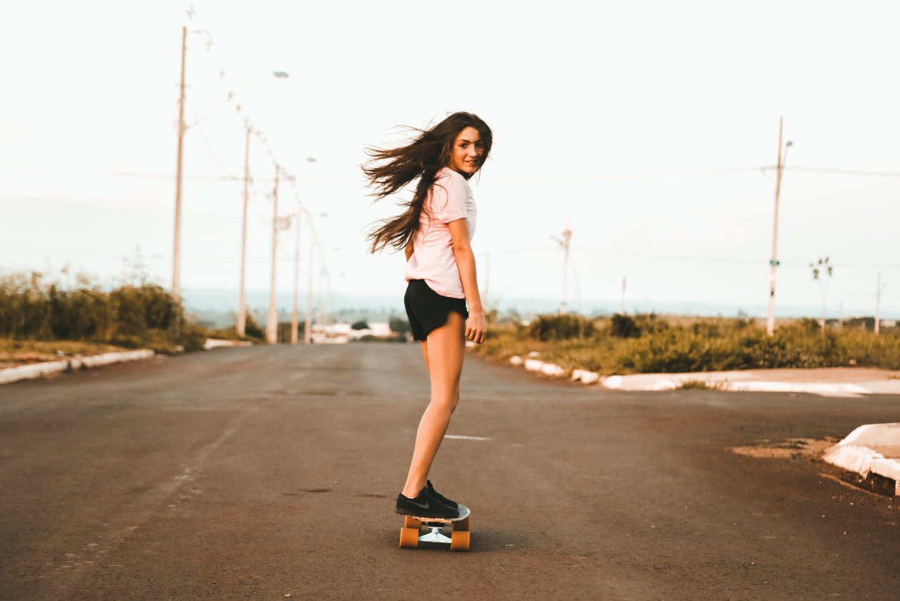 Woman Riding Skateboard At The Road 5k