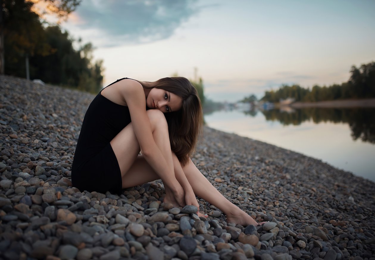 Girl Sitting Rocks Looking At Viewer 4k