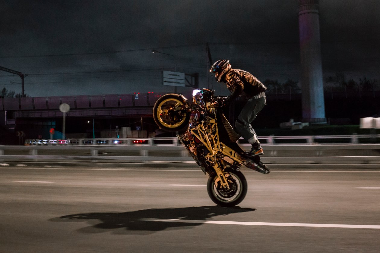 Urban Biker Doing Wheelie