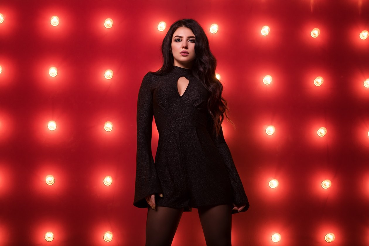 Girl In Black Dress Red Background