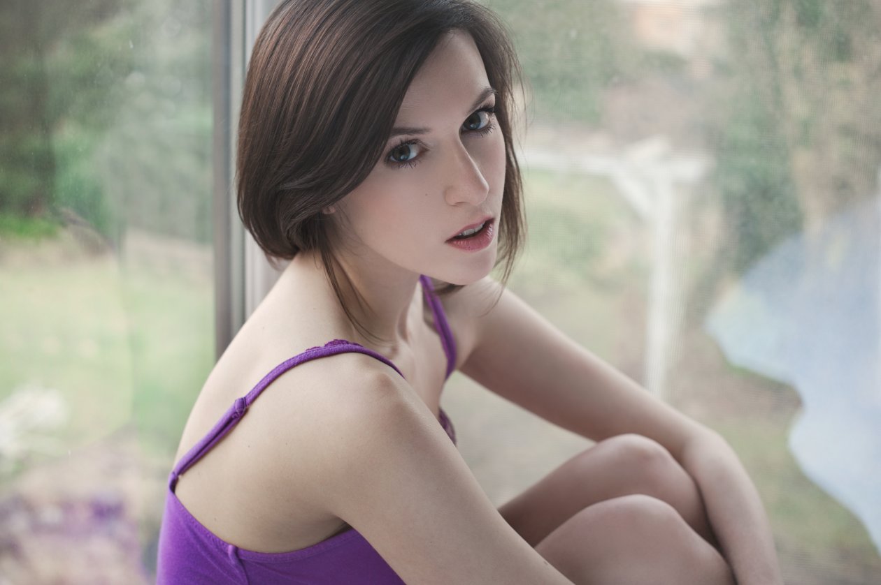 Women Holding Knees Indoors