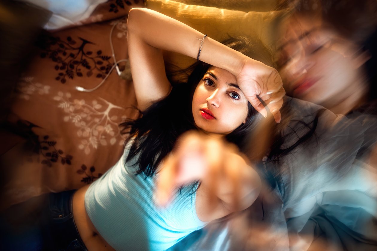 Cute Girl Looking At Viewer Arm On Forehead