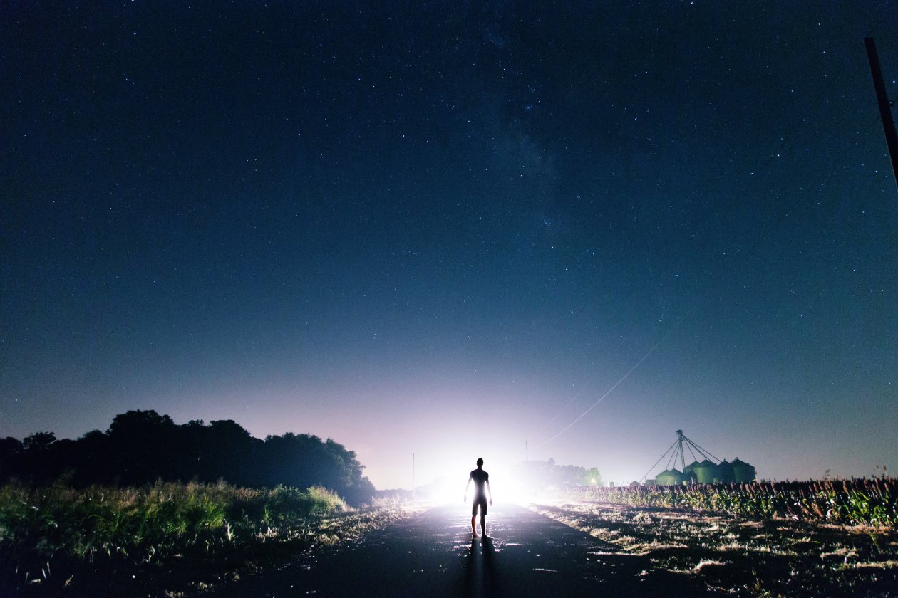 Man Standing In Front Of Light