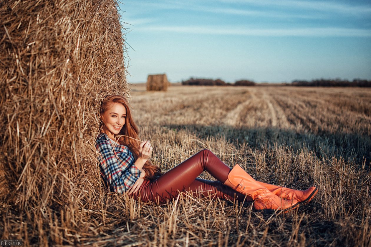 Redhead Women Outdoors In Leather Pants