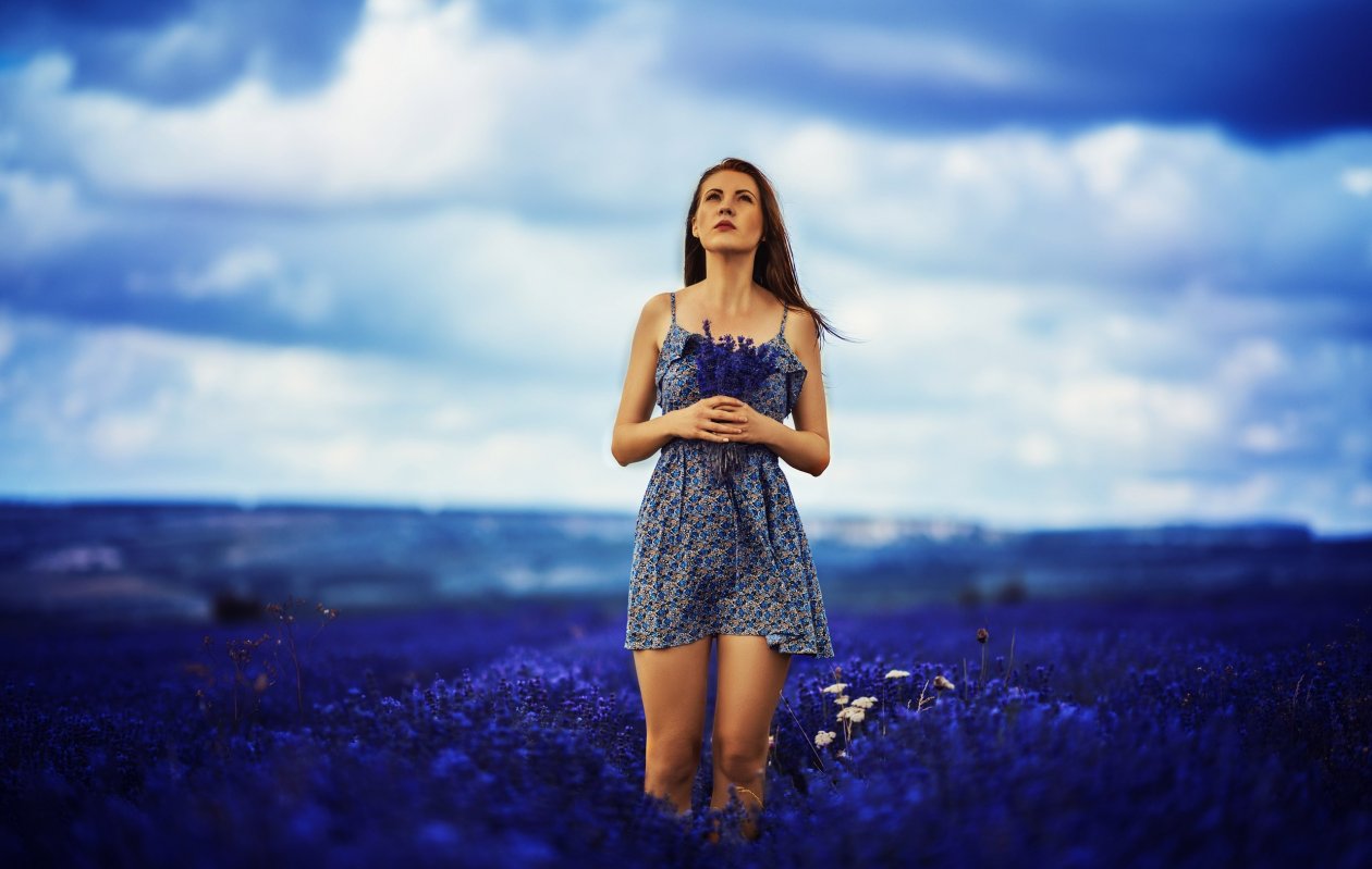 Brunette Girl In Field Of Blue Flowers