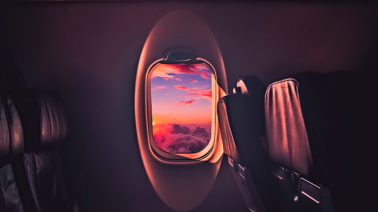 Beautiful Sunset Through Airplane Window