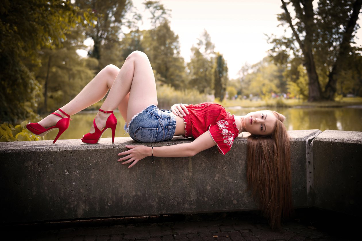Blonde Girl Lying Down Looking At Viewer