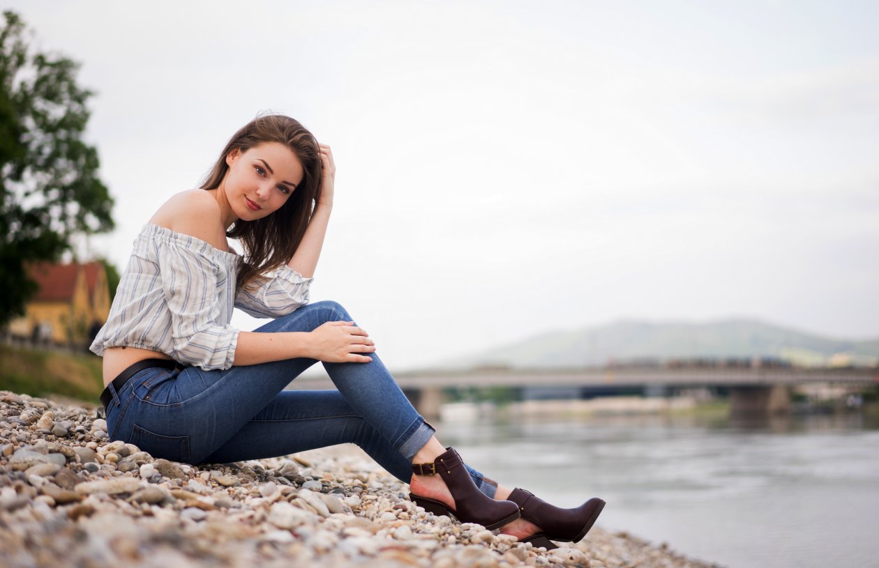 Girl Sitting Rocks Hands In Hair Looking 4k