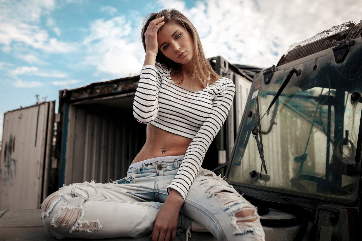 Pierced Navel Girl Sitting On Car Bonnet