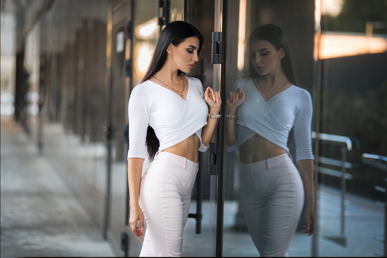 White Jeans Girl Looking Towards Glass