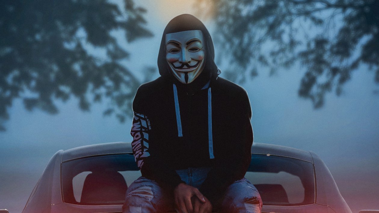 Man Wearing Guy Fawkes Mask While Sitting On Car 4k