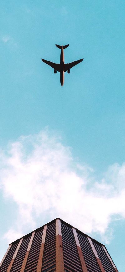 Fond d'écran iPhone Plane Flying Over Building 4k