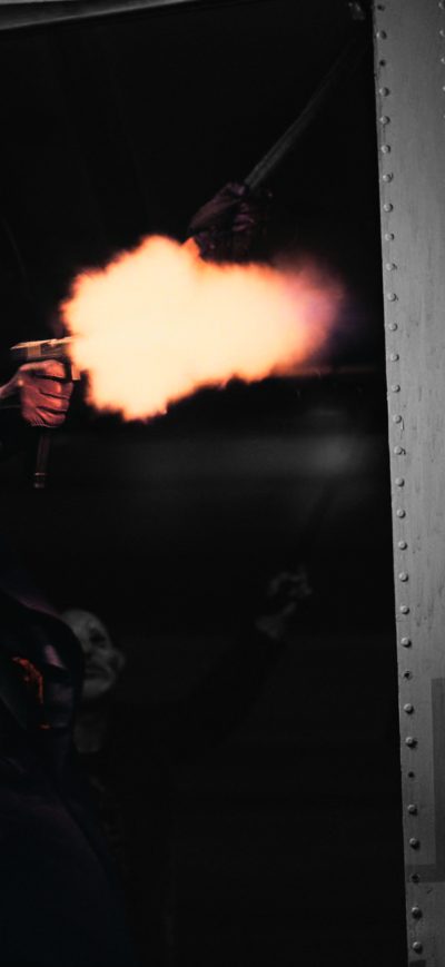 Fond d'écran iPhone The Joker Firing A Glock In The Dark Knight