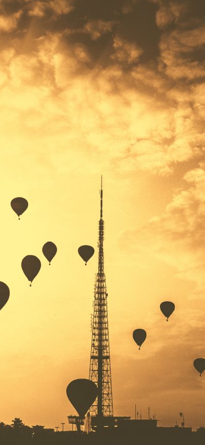 Fond d'écran iPhone Hot Air Balloons Tower Orange Contrast Clouds 5k