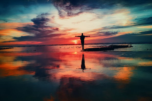 Living The Dream Standing Arms Open At Sea Shore